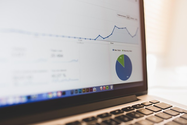 A laptop showing analytics charts on a desk